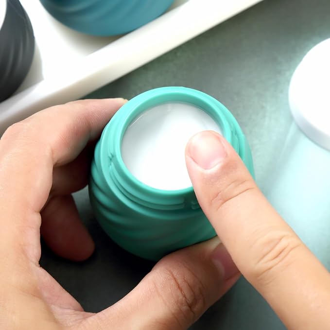 Gemice Silicone Cream Jars TSA Approved Travel Size Containers with Clear Bag, Leak-proof Travel Accessories with Lid for Cosmetic Face Body Hand Cream (4 Pack)