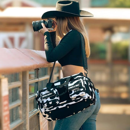 WOLFpak 20L Mini Duffle Bag for Gym & Travel | Waterproof Carry-On Weekender Bag with Shoe Compartment, Hard Bottom, and Tactical Molle System (Black & White Cow)